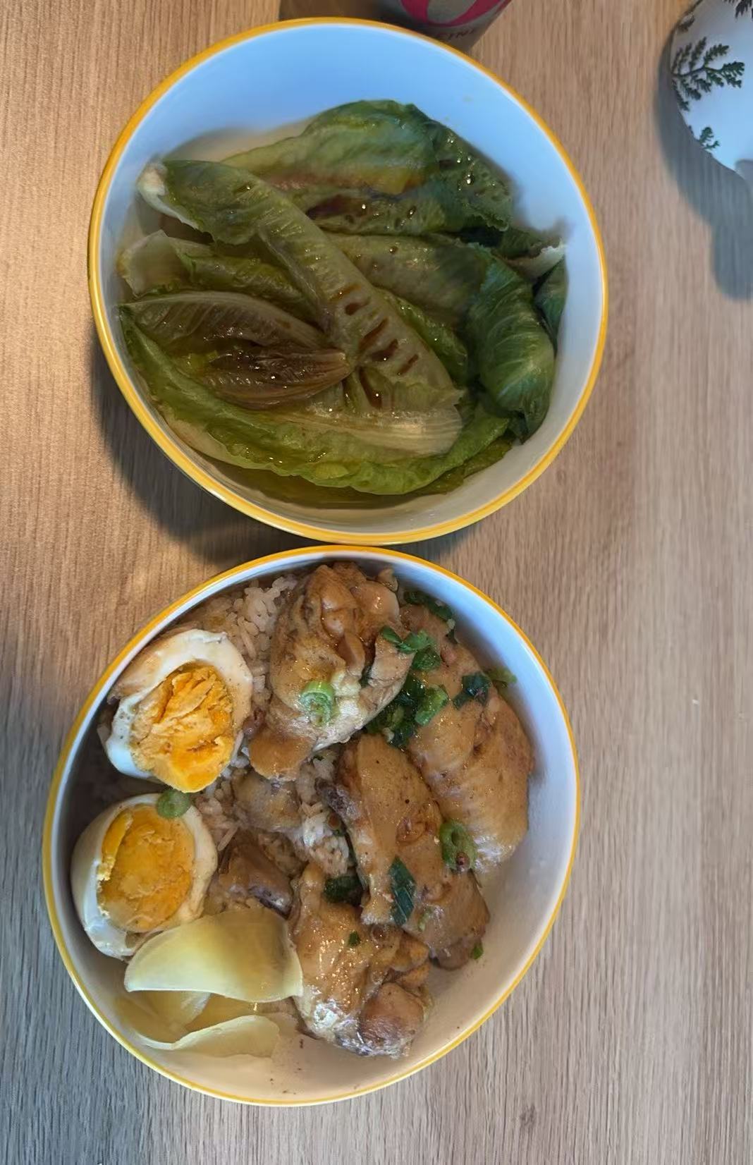 Braised ribs and greens in serving bowls