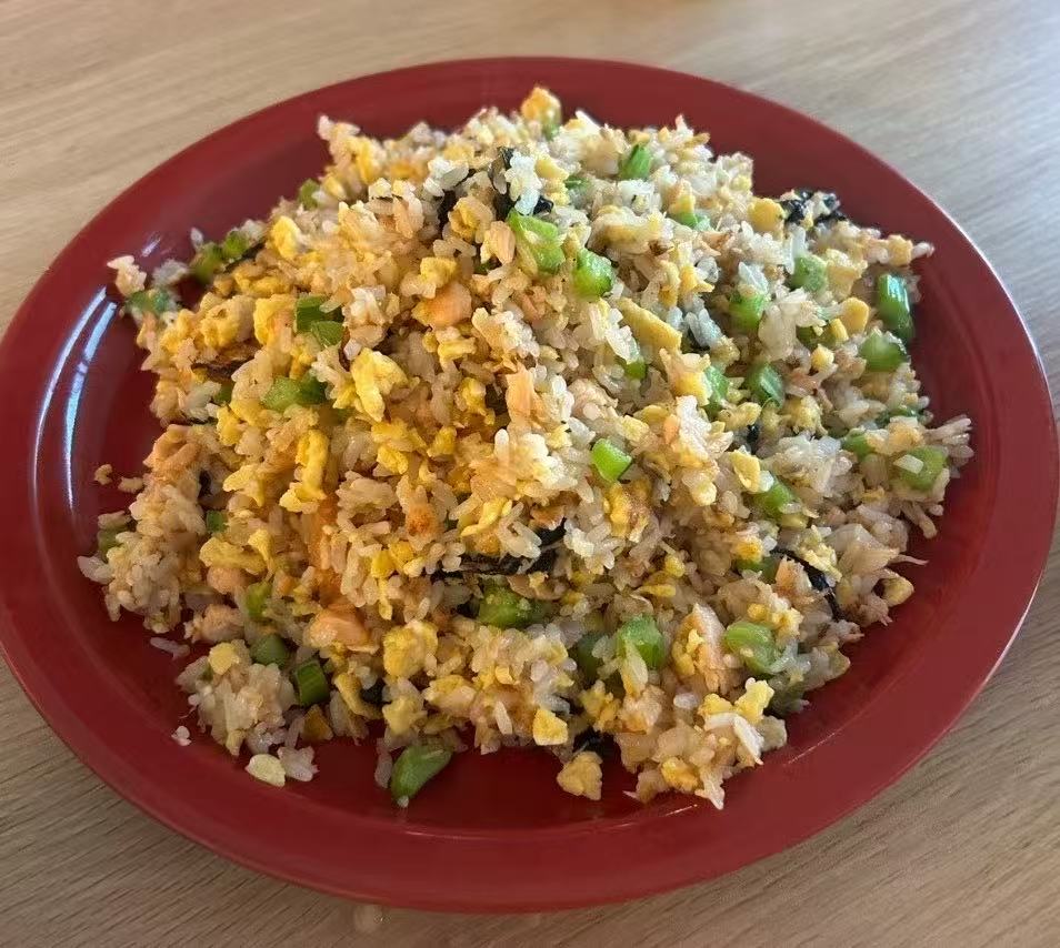 Homemade fried rice on a red plate