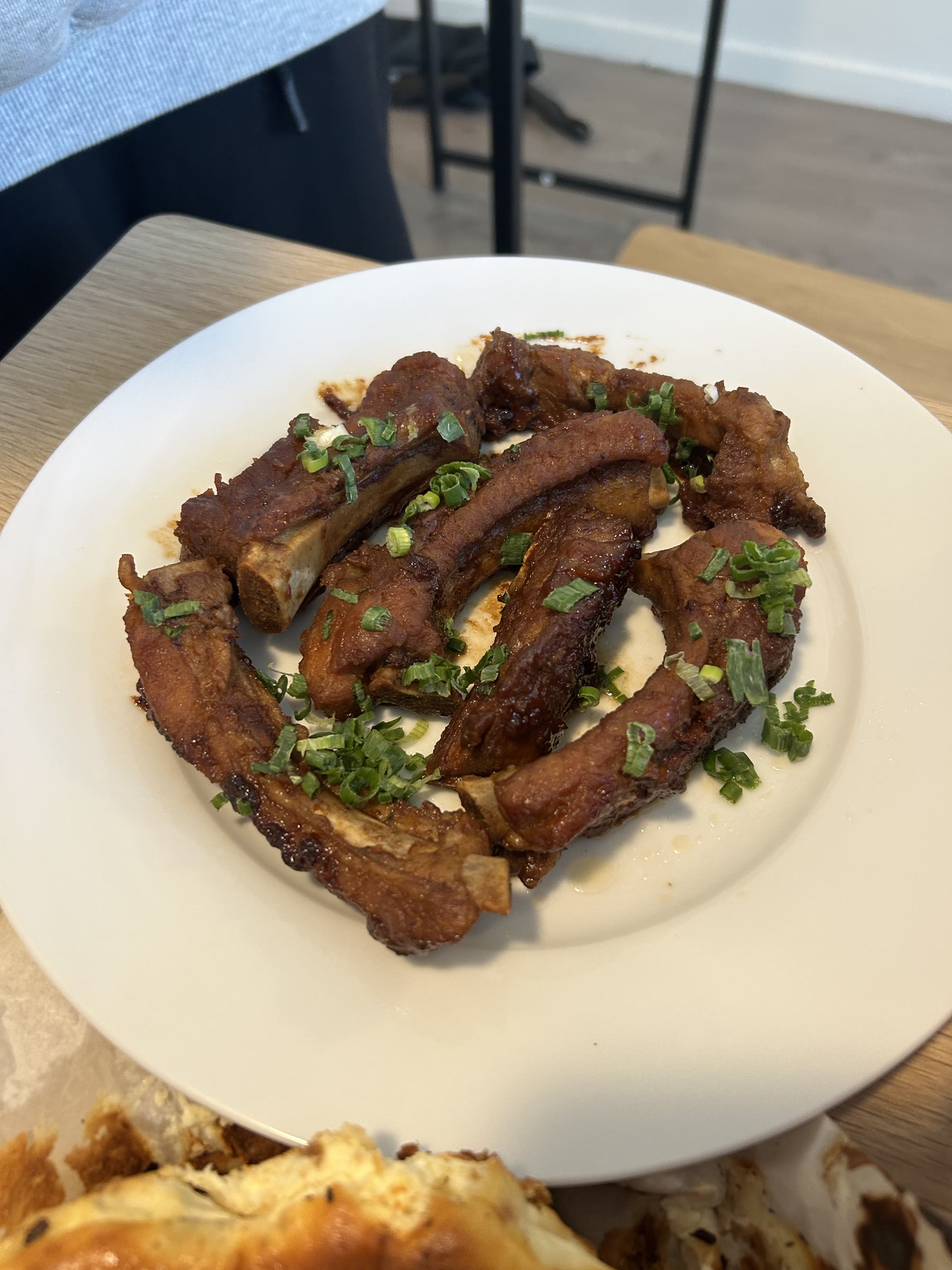 Glazed ribs topped with scallions
